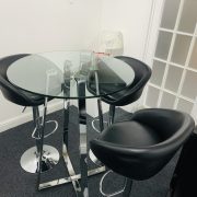 Glass posy table with bar stools